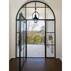 an arched glass door leading to a balcony