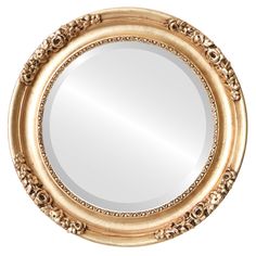 a round mirror with an ornate design on the bottom and gold trimming around it