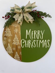 This classic farmhouse Merry Christmas door hanger or wall decor would be a beautiful addition to your Christmas decorations.  This sign measures 18"x18".  This would be wonderful for a housewarming, teacher, or hostess gift.  If you would like me to add a card I would be more than happy to. Just leave your message when you place your order.                                          Thank you for visiting my shop!    Please Like and Follow my Facebook and Instagram pages.  You will get updates on new items I will continue to add. There will be something for every season or everyday reason.                                 -Suzanne.                                                 Wreath365 Joy Door Hanger Christmas, Christmas Door Plaques, Merry Christmas Wreath, Farmhouse Christmas Door Hangers, Christmas Front Door Sign, Round Christmas Signs, Wooden Christmas Signs, Winter Door Hangers, Christmas Door Signs