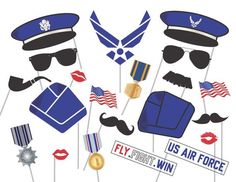 an air force photo booth with mustaches, hats, and flags on sticks that say fly us air force