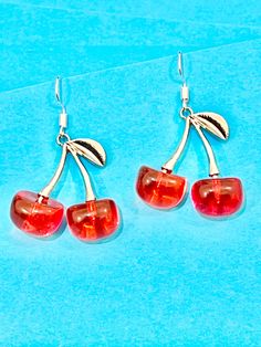 Beautiful red cherry dangle earrings. With good effect edging and silver plated hook. Delicate, fun and funky.  The hook is made of sterling silver to protect your ears and the cherry is made of resin.  They come well presented and wonderful for a present for a friend, family, your loved one or a treat for you.  Thank you for taking the time to look at my earrings and please visit my shop for more original designs. Bespokedanglers.  Sharlene xx  For Fun, Funky, Quirky and original designs, pleas Trendy Red Drop Earrings, Trendy Red Sterling Silver Jewelry, Cherry Colored Drop Earrings With Ear Wire, Cherry Dangle Earrings With Ear Wire, Cherry Drop Earrings With Ear Wire, Cherry Nickel-free Trendy Jewelry, Cherry Color Trendy Nickel-free Jewelry, Trendy Cherry Nickel-free Jewelry, Cherry Colored Round Earrings For Gift