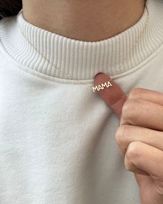 In celebration of all the great mothers around the world, treat the mom in your life to this piece of jewelry they deserve with this gold mama necklace. A perfect way to express what means most to you! Available in 14K yellow, rose or white gold Letters measure about 5mm in height Necklace total length is measured from end to end Dainty minimalist everyday necklace Mama Letter Necklace, Dainty Everyday Charm Necklaces For Mother's Day, 14k Gold Charm Necklace For Mom, Dainty Charm Necklace Gift For Mom, Dainty Charm Necklaces As Gift For Mom, Delicate Yellow Gold Charm Necklace For Mother's Day, Meaningful Gold Birthstone Necklace, Dainty Everyday Necklaces For Mother's Day, Everyday 14k Gold Necklace For Mother's Day