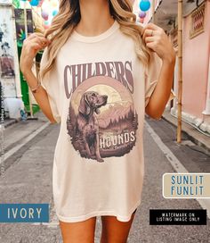 Finish off your country concert outfit with our unique Childers Hounds Shirt, featuring an original graphic inspired by his music lyrics. Crafted on Comfort Colors, this tee combines style and comfort for the perfect addition to your Childers Tshirt Merch collection. Retro T-shirt For Summer Country Concerts, Summer Cotton Shirt For Concerts, Band Merch Shirt For Summer Music Festival, Summer Band Merch Shirt For Music Festival, Summer Band Merch Shirt With Custom Print, Band Merch Shirt With Screen Print For Summer, Band Merch Screen Print Shirt For Summer, Summer Band Merch Shirt With Screen Print, Band Merch Cotton Shirt For Summer