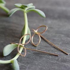 Sweet botanical earrings with a modern edge. These delicate petal threaders are subtle enough to wear everyday, with an interesting and somewhat unexpected design that you won't get tired of. 1/2" open petal shape dangles with fixed wire threader ear wire. Available in sterling silver, 14k gold fill (as shown), or mixed metal. All Rebecca Haas Jewelry is handcrafted by me in my Southern Vermont Studio from recycled and ethically sourced materials. Delicate Nickel-free Drop Threader Earrings, Delicate Nickel-free Threader Drop Earrings, Dainty Handmade Teardrop Threader Earrings, Delicate Sterling Silver Threader Earrings, Delicate Gold Threader Earrings With Ear Wire, Delicate 14k Gold Threader Earrings With Ear Wire, Delicate Rose Gold Threader Earrings, Contemporary Handmade Jewelry, Threader Earrings Gold