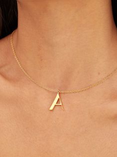 Light in weight but heavy in meaning, our Signature Initial Necklace does more than spell a name. This initial collection is a celebration of people, places, and things that represent you -- creating a deeply meaningful and bespoke piece that is a great go-to piece for every day. Medium in size, the letter pendant is 24K gold-plated and threads through a delicate gold-plated chain. Available in letters A through Z. Dimensions: Sheet Thickness: 0.08in (2mm)Wire Thickness: 0.04in (0.9mm)Overall he Modern Gold Initial Necklace Gift, Modern Gold Necklace With Initials, Modern Gold Necklaces For Anniversary, Modern Gold Initial Pendant Necklace, Recycled Gold Initial Pendant Necklace Gift, Gift Initial Pendant Necklace In Recycled Gold, Gift Recycled Gold Initial Pendant Necklace, Modern Gold Initial Necklace For Anniversary, Personalized Gold Necklaces In Recycled Gold