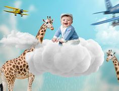 a baby sitting on top of a cloud with giraffes and airplanes in the background