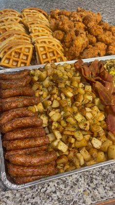 several trays filled with different types of food