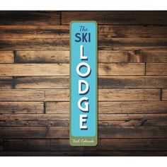 the sky lodge sign on a wooden wall with wood planks in the back ground