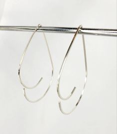 Modern Nickel-free Drop Jewelry, Modern Silver Teardrop Hoop Earrings, Modern Hypoallergenic Teardrop Jewelry, Modern Nickel-free Drop Hoop Earrings, Nickel-free Silver Teardrop Wrap Earrings, Nickel Free Silver Teardrop Wrap Earrings, Silver Small Hoop Teardrop Earrings, Modern Drop Earrings With Ear Wire, Silver Nickel-free Teardrop Wrap Earrings