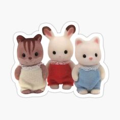 three small stuffed animals sitting next to each other