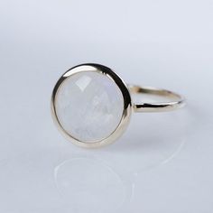 14K gold rainbow moonstone ring. A gorgeous moonstone ring, ideal for every woman who loves elegant style. An excellent choice for anniversary gift for her or birthday gift or Mothers Day Gift. The gemstone is natural and conflict-free mined.  100% handcrafted with love!PRODUCT DETAILS● Material: 14K solid gold, white gold, rose gold● Gemstone: Moonstone, briolette cut● Stone Diameter: 8mm (0.3in) or 10mm (0.4in) RING SIZING For General Reference:● we use standard US Ring Sizing● an average wome Elegant Gold Moonstone Ring With Natural Stones, Minimalist Natural Stone Ring For Anniversary, Moonstone Rings With Bezel Setting, Elegant Birthstone Ring With Natural Stones For Promise, Gold Faceted Moonstone Ring, Faceted Gold Moonstone Ring, Delicate 14k Gold Moonstone Ring, Elegant Birthstone Ring With Natural Stones, Elegant 14k Gold Moonstone Ring