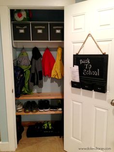 an open closet with shoes and backpacks hanging on the wall next to it is a chalkboard sign that says back to school