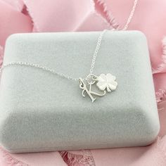 A dainty Silver Initial Charm Necklace with a lucky Four Leaf Clover. This dainty necklace is ideal for layering or wearing as a stand-alone signature necklace. • D E T A I L S •• 10mm charms• Sterling Silver• Dainty Style• 3 chain lengths available (16, 18, and 20 inches) Dainty Personalized Small Charm Necklaces, Dainty Personalized Small Charm Necklace, Delicate Hypoallergenic Charm Necklace As Gift For Her, Silver Charm Necklace With Delicate Chain For Good Luck, Delicate Tarnish-resistant Silver Charm Necklace, Good Luck Sterling Silver Necklace With Delicate Chain, Good Luck Charm Necklace With Delicate Chain, Personalized Initial Pendant Necklace For Good Luck, Minimalist Personalized Good Luck Necklace