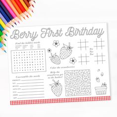 the berry first birthday activity book is next to colored pencils