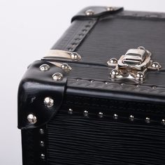 This Black EPI Leather suitcase is the perfect companion for your travel adventures. Featuring a classic trunk style that incorporates the previous original luggage designs of Louis Vuitton. With a spacious interior and an extremely sturdy exterior, you can that your items are going to be kept safely. Louis Vuitton has ensured security with this design, it comes with a 3 fastenings systems, 2 buckles and a lock with 2 spare keys. The all black leather exterior is chic and classy whilst the silver toned studs and rivets add a luxurious extra touch. SPL Exterior Noir Epi leather Lock with spare keys and two complimentary trunk latches Leather Trim Silver toned brass rivets and studs Top handles Very good condition, one scratch on the front of the suitcase Date Code AAS46365 Interior Canvas i Japanese School Bag, Trunk Luggage, Leather Trunk, Leather Suitcase, Luggage Straps, Japanese School, Diaper Backpack, Exclusive Bag, School Bag