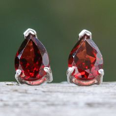 In jewelry, it is often believed that the pear cut represents a tear of joy, making this gemstone shape prominent in glamorous accessories. Drawing inspiration from refined trends, Thailand's Roongnapa presents these sterling silver drop earrings with two natural garnet jewels in a faceted style and pear shape, symbolizing perseverance and totaling one carat. Fine Jewelry Pear Teardrop Earrings For Anniversary, Fine Jewelry Pear-shaped Teardrop Earrings For Anniversary, Anniversary Pear-shaped Teardrop Earrings In Fine Jewelry Style, Sterling Silver Briolette Teardrop Gemstone Earrings, Formal Pear-shaped Teardrop Earrings, Sterling Silver Briolette Teardrop Earrings For Gift, Pear-shaped Teardrop Earrings For Anniversary, Faceted Pear-shaped Earrings For Gift, Pear-shaped Gemstone Teardrop Earrings For Anniversary