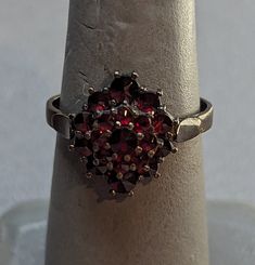 Antique Bohemian Garnet 900 Silver ring. Ring features three layers of rose cut Garnets prong set. Ring is fully hallmarked and will arrive gift boxed. HALLMARKS 900. SIZE 6, ring could be resized by any jeweler. Ring measures 14mm running north to south on finger. WEIGHT 2.56 Grams. CONDITION In very good to excellent condition, please use all pictures as part of description. MATERIALS 900 Silver, Garnets. Antique Ruby Ring, Ruby Engagement Ring, Fancy Jewellery, Red Band, Set Ring, Unisex Ring, Art Deco Era, Ruby Ring, Ring Ring