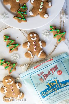 gingerbread cutout cookies with frosting and sprinkles on a plate