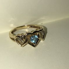 10 Karat Gold Heart Ring. The Center Is A Blue Heart And On The Sides Are Tiny Diamonds. Very Well Taken Care Of Pretty Much Brand New. I’m Selling It Because It Was From An Ex Boyfriend And I’m Married Now So I’m Cleaning Out My Jewelry Box :) Great Gift Or A Gift To Yourself Im Pretty Sure It’s A Size 6 Heart Cut Multi-stone Anniversary Rings, Anniversary Sapphire Jewelry With Heart Charm, Heart Cut Blue Topaz Birthstone Jewelry, 14k Stamped Heart Cut Promise Jewelry, Stamped 14k Heart Cut Promise Jewelry, Heart Cut Blue Topaz Rings For Anniversary, Heart Cut 14k Stamped Promise Jewelry, Heart-shaped Blue Topaz Birthstone Jewelry, Heart Cut 14k Jewelry For Promise