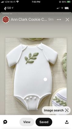 an image of a baby's bodysuit made out of cookies on a cell phone