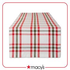 a red and green plaid tablecloth with stars on the bottom, in front of a white background