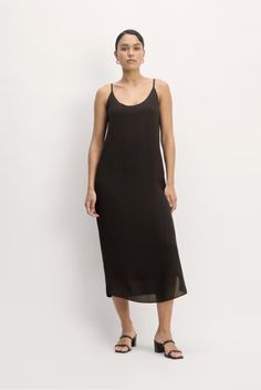 Our favorite slip dress, now in lighter weight viscose. This piece features a scoop-neck, relaxed fit, midi length, slip silhouette, sleeveless, spaghetti straps, in viscose.

100% Viscose Summer Slip Dress, Midi Length, Spaghetti Strap, Scoop Neck, Slip Dress, Spaghetti, Women's Fashion, Black Dress, Relaxed Fit