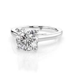 This beautiful round brilliant cut engagement ring features a minimalist fully polished plain aesthetic. The beautiful center stone stands proudly. Optional matching band is available. 1.5 carat center stone shown. This ring is made to order. Please select your options and allow 2-3 weeks for delivery. Plain Band Engagement Ring, Plain Aesthetic, Brilliant Cut Engagement Ring, Round Brilliant Cut Engagement Ring, Wedding Day Jewelry, Moissanite Engagement Ring Solitaire, Round Solitaire, Engagement Rings Platinum, Diamond Guide