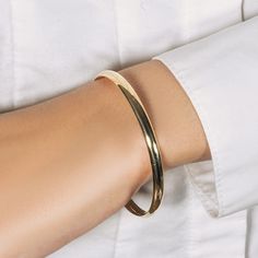 Radiating, elegance, and simplicity this dome style bangle feature a polished finish. Designed in fine 10k yellow tone gold.Product Details: Bangle Information : Metal : 10K Yellow Gold Width : 0.13 in Approximate Weight: Size Weight 7'' 4.2 grams Classic Gold Bangle Tarnish Resistant, 14k Gold Bangle With Shiny Finish, Formal Gold Plated Bangle With Polished Finish, Gold Bangle With Shiny Finish In 14k, Classic Gold Bangle With Shiny Finish, Classic Gold Bangle For Everyday, Classic Tarnish Resistant Round Bangle, Classic Tarnish-resistant Round Bangle, Elegant Everyday Solid Color Jewelry