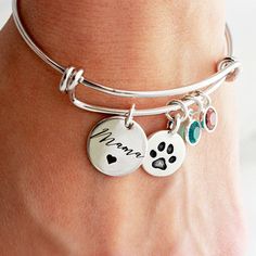 A paw charm for all our “Dog Mamas” out there! How many fur babies do you have?? Mom Bracelet Personalized, Paw Print Bracelet, Mom Bracelet, Memorial Bracelet, Moms Bracelet, Birthstone Bracelet, Dog Mama, Dog Pin, Birthstone Bracelets