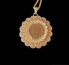 Magnificent large new quality pendant in stainless steel (and its twisted chain with solid clasp) in gold color openwork filigree flower our the finesse of the decorations set with an antique coin 1938 old antique coin collection with a very beautiful patina as we like, it is an original and unique creation guaranteed to fall in love with you! This Made in France pendant will seduce you with its originality, its unique side, its shimmering colors as well as the harmonious contrast of the gold wh Ornate Coin Pendant Jewelry, Antique Gold Filigree Round Pendant Jewelry, Elegant Antique Gold Coin Pendant Jewelry, Elegant Antique Gold Jewelry With Coin Pendant, Ornate Medallion Coin Pendant Jewelry, Ornate Medallion Jewelry With Coin Pendant, Luxury Filigree Medallion Necklace, Luxury Filigree Medallion Necklaces, Ornate Coin Pendant Necklace As Gift