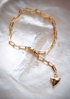 This 18kt Gold Filled Paperclip Link Chain Bracelet adds a modern element to your bracelet collection. It features the popular paper clip chain style and a vermeil shark tooth charm dangling from the end for that added statement. An on trend style and new staple.Handmade in Maui, Hawaii.✦ DETAILS ✦✧ Name: Kaiea - (kaee EH ah) - rising tide.✧ Adjustable length up to 8 Inches. ✧ 18kt gold filled with lobster clasp.✧ Vermeil Shark Tooth Charm.✧ All Ke Aloha Jewelry pieces come packaged thoughtfully Gold-tone Paperclip Bracelet With Lobster Clasp As A Gift, Gold-tone Paperclip Bracelet With Lobster Clasp For Gift, Gold Plated Paperclip Bracelet With Lobster Clasp As Gift, Gold-plated Paperclip Bracelet With Lobster Clasp As Gift, Gold Plated Paperclip Bracelet As Gift, Gold Paperclip Chain Bracelet Gift, Gold-tone Paperclip Bracelet Chain As Gift, 14k Gold Paperclip Chain Bracelet Gift, Gold-tone Paperclip Chain Bracelet For Gift