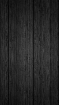 a dark wood background with vertical planks