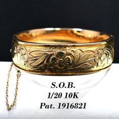 *Description: This is a gorgeous gold filled hinged floral bracelet by S.O. Bigney Co. who was in business from 1896 to 1946.  This beautiful bracelet has a patent number of 1916821 which puts the bracelet at 1933. The bracelet is in great condition and the information or hallmark is stamped on the tongue of the clasp.  It has a safety chain to protect from loss. The clasp snaps securely in place.  It is almost 100 years old and would be a great heirloom bracelet to pass down in your family. Thi Vintage Yellow Gold Bangle Stamped 14k, Vintage 14k Stamped Yellow Gold Bangle, Vintage 14k Stamped Gold Bangle Bracelet, Vintage 14k Gold Hallmarked Bangle, Vintage 14k Stamped Round Bangle, Vintage Yellow Gold Bangle For Gift, Vintage Yellow Gold Bangle Gift, Vintage 14k Stamped Gold Bangle, Vintage 14k Stamped Bangle Bracelet