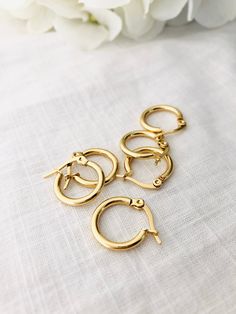 Gold Surgical Steel 15mm Hoop Earrings. These hoops are classy and timeless.Item Details: This listing is for a pair of 15mm hoop earrings. high-quality surgical steel - The stainless steel will not change color and can be worn in the water. Simply use gentle soap and water to clean. • Hoop size: 2 mm x 15 mm. Hypoallergenic Metal Huggie Earrings, Nickel Free Huggie Hoop Earrings In Stainless Steel, Nickel-free Huggie Hoop Earrings In Stainless Steel, Minimalist Stainless Steel Tarnish Resistant Huggie Earrings, Nickel-free Small Hoop Stainless Steel Earrings, Nickel-free Stainless Steel Hoop Cartilage Earrings, Nickel-free Stainless Steel Small Hoop Earrings, Small Stainless Steel Nickel-free Hoop Earrings, Nickel-free Small Stainless Steel Hoop Earrings