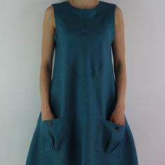 "Handmade teal linen dress sleeveless, perfect for casual wear and suitable for any occasion in summer season Details: - 100% natural linen produced in Europe ; - medium weight (180 gram per square meter); - color: teal, could be any from our colors catalogue (color samples at the photo); Made to order, approximately a few days, If you have any questions please message me and I will be glad to answer. Size guide : Size XS Bust: fits bust around 33\"-34\"/ 84-88 cm Waist: fits waist around 25\"-2 Blue Sleeveless Dress With Pockets For Summer, Summer A-line Sundress With Pockets, Summer Linen Shift Dress, Sleeveless Turquoise Maxi Dress For Spring, Turquoise Sleeveless Maxi Dress For Spring, Blue Cotton Sleeveless Dress With Pockets, Knee-length Sundress With Pockets, Sleeveless Turquoise Sundress For Summer, Turquoise Sleeveless Sundress For Summer