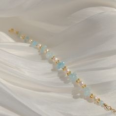 Capture the summer breeze with this charming Aquamarine and Pearl bracelet. Handcrafted with various shades of blue aquamarine and genuine pearls, it's the perfect accessory to elevate your look. Enjoy the beauty and elegance of this bracelet wherever the summer takes you. Details 4.5-5mm freshwater pearls. Blue aquamarine beads. 14k gold filled. Wanna browse more of my bracelet series? https://www.etsy.com/ca/shop/PrettyPearlfect?section_id=31793519 Take a look at my shop to discover more piece Delicate Adjustable Blue Beaded Bracelets, Elegant Hand-strung Beaded Bracelets For Beach, Adjustable Pearl Bracelets With Gemstone Beads, Delicate Gemstone Beaded Bracelets, Dainty Adjustable Pearl Bracelet With Gemstone Beads, Delicate Gemstone Beaded Bracelets With Round Beads, Delicate Gemstone Bracelets With Round Beads, Adjustable Natural Stone Beaded Bracelets For Wedding, Delicate Adjustable Gemstone Beaded Bracelets