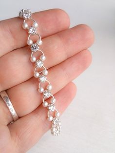 Shop beautiful Faux pearl & clear rhinestone silver chain bracelet, 7 1/2 inches long, dainty, feminine bracelet. Vintage classic sparkly jewelry. The bracelets are wonderful gift for woman for any occasion. Bracelet width  approximately - 7 inches Bracelet length approximately - 0.4 inches Condition: Excellent. ♛All jewerly are carefully and lovingly packaged in beautiful gift boxes. If you choose jewelry for a gift, you can not worry about gift wrapping) If your order more than 100$ (not count Silver Dainty Pearl Bracelet, Dainty Silver Metal Pearl Bracelet, Silver Pearl Bracelet With Adjustable Chain For Wedding, Wedding Pearl Bracelet With Adjustable Silver Chain, Dainty Chain Bracelets For Wedding, Delicate Metal Chain Bracelet For Wedding, Elegant Bling Chain Bracelet, Silver Pearl Chain Bracelet For Wedding, Pearl Bracelets