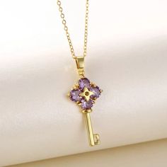 Material 18k Gold Plated Simulated Diamonds. Purple Flower Key Necklace Gold Plated Purple Jewelry For Gifts, Purple Gold Plated Jewelry For Gifts, Purple Gold Plated Jewelry Gift, Purple Gold-plated Jewelry Gift, Elegant Lavender Flower Shaped Jewelry, Purple Gold Plated Necklace For Gift, Purple Gold-plated Necklace As A Gift, Purple Gold-plated Necklace For Gift, Gift Purple Gold Plated Necklace