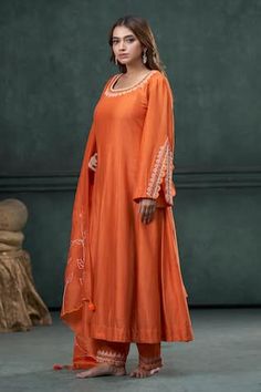 Orange anarkali with an embroidered neckline and sleeves. Paired with a line embroidered pant and scallop dupatta with tassels. - Aza Fashions Anarkali Dupatta With Embroidered Border For Eid, Anarkali Dress With Embroidered Border For Eid, Anarkali Wedding Set With Embroidered Border, Bollywood Style Festive Dress With Embroidered Border, Bollywood Festive Dress With Embroidered Border, Festive Bollywood Dress With Embroidered Border, Unstitched Anarkali Set With Embroidered Border For Wedding, Chanderi Dress With Embroidered Border For Diwali, Festive Straight Kurta Dress With Embroidered Border