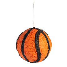 an orange and black ball hanging from a string