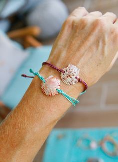 This is a pretty pink scallop shell wax cording slide knot bracelet. It is made with a double teal wax polyester cording and is adjustable with a cording slide knot. These are made with the same wax cording as the pura vida bracelets. They look amazing stacked with other bracelets! This bracelet is waterproof and looks great as a bikini accessory at the beach! Light weight and adjusts to any size. Feel free to ask questions.  Thanks for looking! Live in an ocean state of mind... every single day. Adjustable Ocean-inspired Shell For Beach Season, Pink Nylon Cord Bracelets For Beach, Summer Shell Friendship Bracelet Gift, Adjustable Coastal Shell For Beach Season, Summer Beach Bracelets With Nylon Cord, Summer Beach Bracelets Made Of Nylon Cord, Nylon Cord Bracelets For Beach In Summer, Resizable Waxed Cord Friendship Bracelets For Beach, Summer Beach Jewelry With Nylon Cord