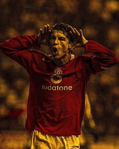 a soccer player holding his hands to his head