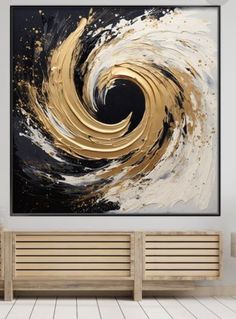 an abstract painting with gold and black swirls on the wall above a wooden bench