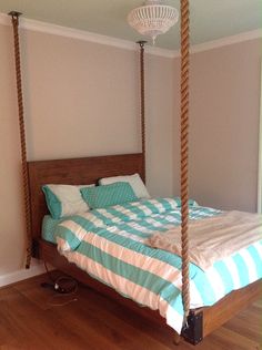 a bedroom with a bed that has a wooden frame