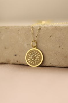 Gold Sun Pendant - Sun Gold Necklace ● Material of pendant: Solid Gold 14k ( REAL GOLD ) ● Metal Stamp: 14k ( REAL GOLD ) ● The pendant is available in 5 sizes: - 12,7 mm / 0.5 inches (Diameter) - 14,0 mm / 0,55 inches ( Diameter ) In the photos - 15,3 mm / 0.6 inches ( Diameter ) - 16,5 mm / 0,65 inches ( Diameter ) - 19,1 mm / 0,75 inches ( Diameter ) ( In the photos the size is 14mm / 0.55 inches Diameter ) ( Jump Ring inner diameter: 4 mm ) ● Material of chain: Solid gold 14k ( REAL GOLD ) I 14k Gold Filled Yellow Gold Charm Necklace For Anniversary, Yellow Gold Medallion Jewelry As A Gift For Her, Spiritual 14k Gold-filled Yellow Gold Charm Necklace, Spiritual 14k Gold Filled Yellow Gold Charm Necklaces, Yellow Gold Plated Round Charm Necklace, Tarnish Resistant Yellow Gold Charm Necklace For Her, Yellow Gold Plated Charm Necklace As Gift For Her, 14k Yellow Gold Medallion Charm Necklace, Yellow Gold Plated Charm Necklace For Her