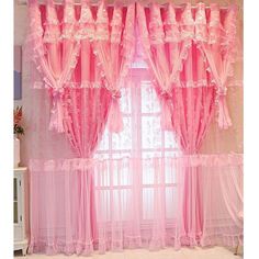 the pink curtains are hanging in front of the window