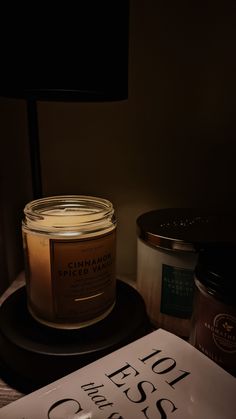 a candle and some books on a table