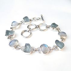 Natural Aquamarine & Rainbow moonstone 925 Sterling Silver Bracelet, Multi stone Bracelet, Gemstone Bracelet, Royal Handmade Bracelets, Product:- Ring Modal no:- U212 Metal:- 925 Sterling Silver Gemstone :- Aquamarine & Moonstone Gemstone size:- 10x12 mm Finishing:- Shiny silver We are using Pure 925 (Stamped) Sterling Silver with Natural Gemstone Jewelry, all of our jewelry designs are Handmade. We are adding new creative designs in our store regularly, for new handmade stuff please get Luxury Silver Moonstone Gemstones, Luxury Polished Sterling Silver Gemstones, Cheap Handmade Silver Crystal Bracelet, Elegant Luxury Silver Gemstones, Luxury Classic Sterling Silver Gemstones, Luxury Silver Moonstone Bracelets, Sterling Silver Bracelet With Gemstone And Moonstone, Silver Bracelets With Natural Moonstone, Silver Moonstone Bracelet With Natural Stones