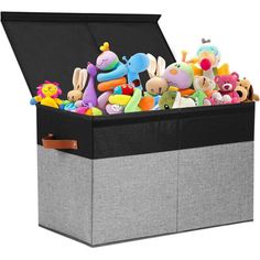 an open storage box filled with stuffed animals