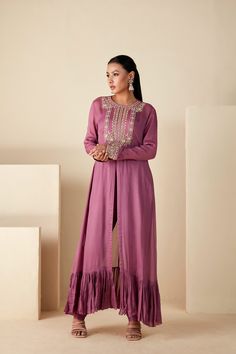 Embrace regal elegance with our Mauve Majesty Zardosi Kurta Set. Adorned with exquisite hand-embroidered zardosi, this set pairs a detailed kurta with sleek slim-fit pants for a modern twist. The luxurious georgette crepe and Tussar silk blend, in a delicate mauve, ensure a graceful drape with a comfortable fit. Designer Raw Silk Palazzo Set With Dori Work, Diwali Anarkali Set With Resham Embroidery And Front Open, Embroidered Raw Silk Palazzo Set For Reception, Designer Resham Embroidered Front-open Anarkali Set, Front Open Georgette Anarkali Set With Zari Work, Designer Semi-stitched Front Open Anarkali Set, Designer Wear Front Open Salwar Kameez With Zari Work, Elegant Front Open Anarkali Set In Georgette, Elegant Front Open Georgette Anarkali Set